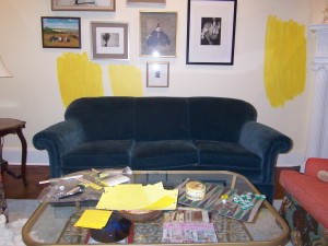 Yellow paint samples over blue sofa Yellow paint samples over blue sofa