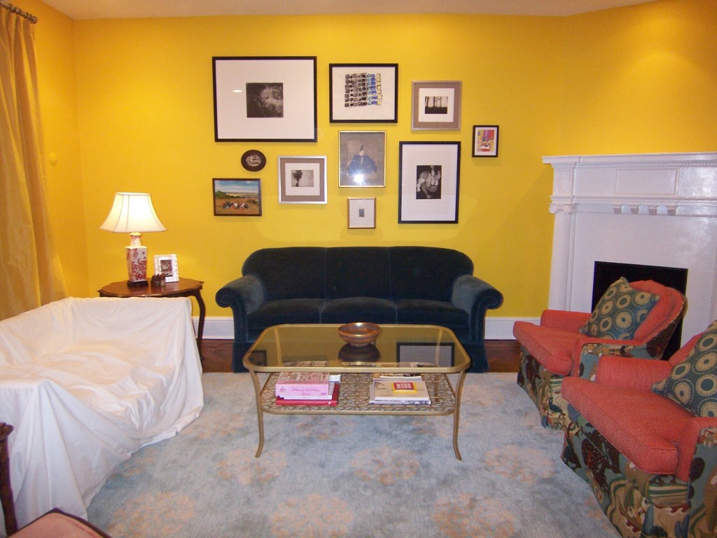 Yellow living room with art wall
