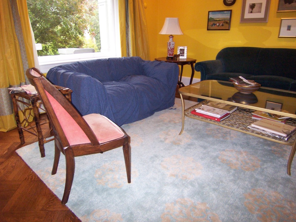 Loveseat with loose blue slipcover