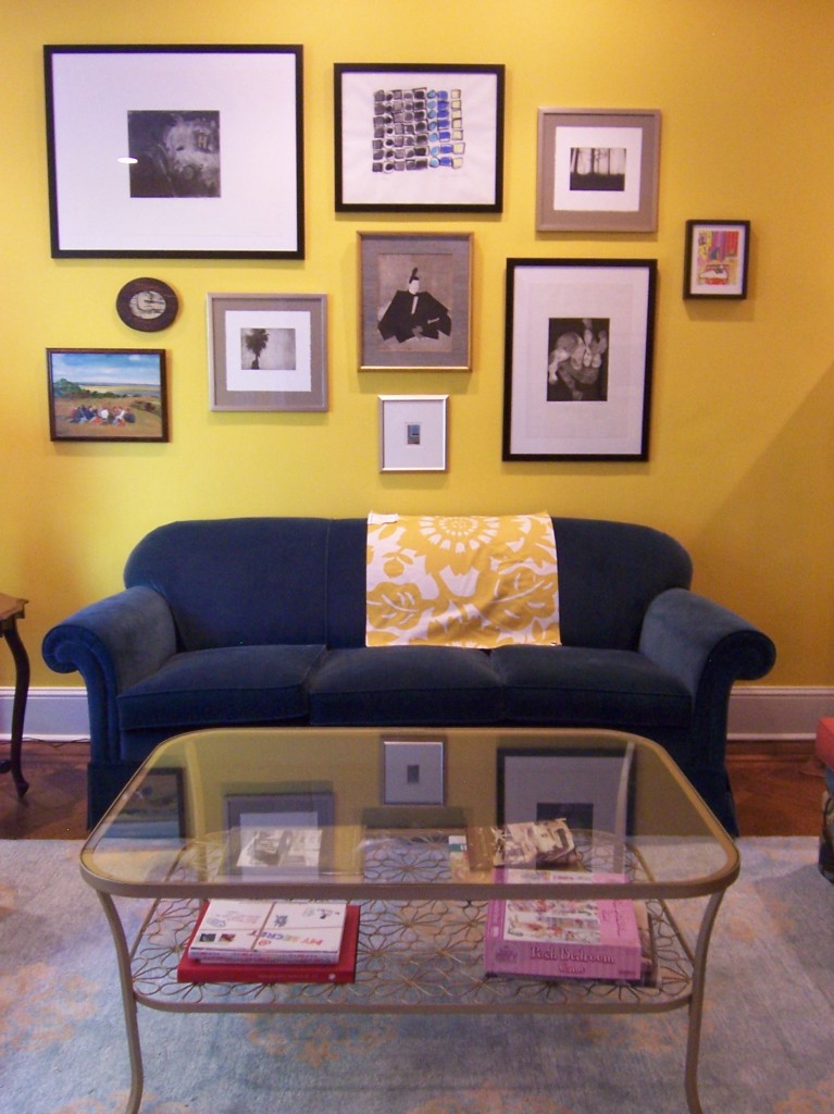 Art wall with blue sofa