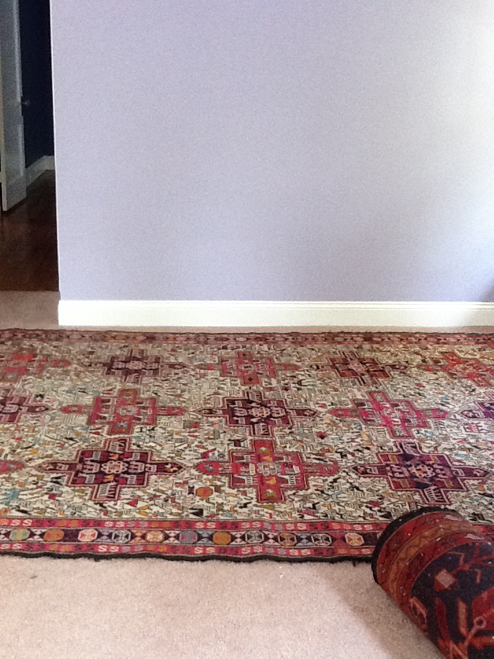 Closeup lavender walls with silk rug