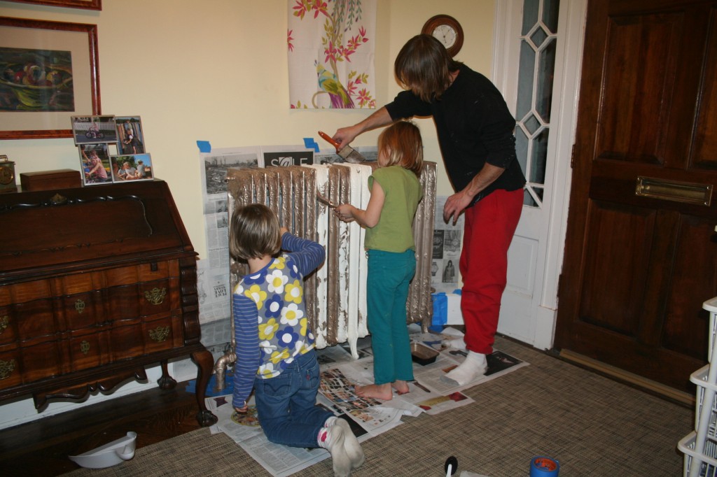 Girls and Uncle Jimmy painting the radiator Girls and Uncle Jimmy painting the radiator