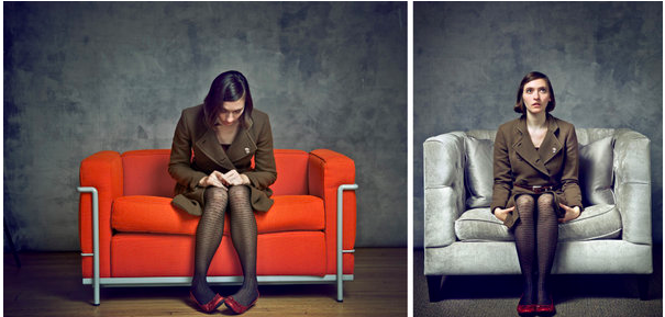 Woman sitting in oversized chair and regular chair