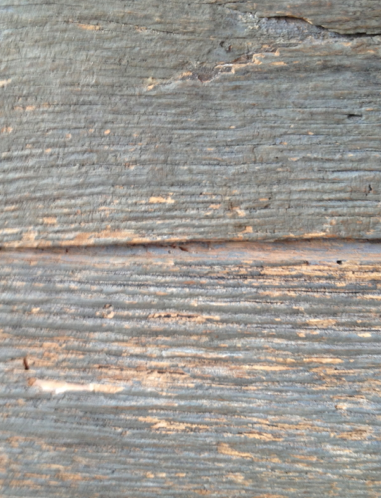 Gray-painted wood with natural wood showing through