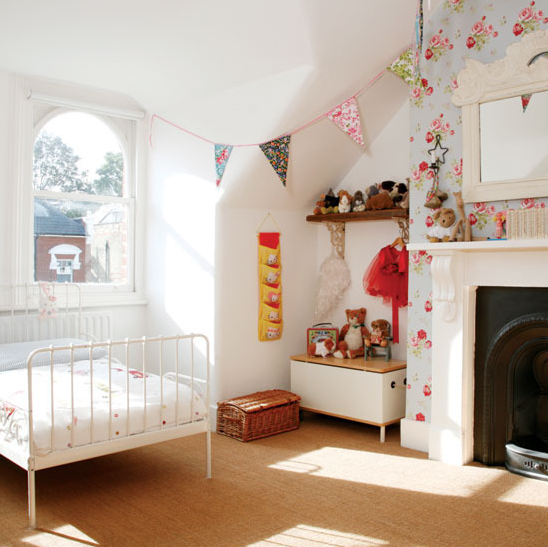 Floral wallpaper around fireplace