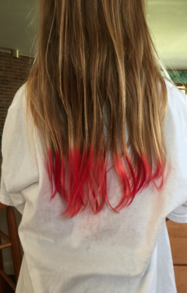 Girl's long hair with red dye at the tip