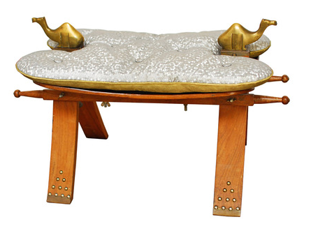 Low stool with wooden legs and cushion