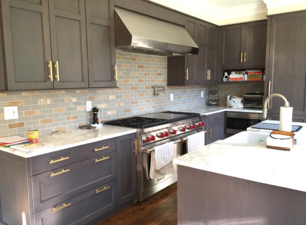 Kitchen renovation with gray cabinets and marble countertops in Chevy Chase by Aidan Design and bossy color