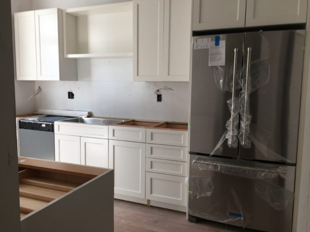 White cabinets galley kitchen renovation 