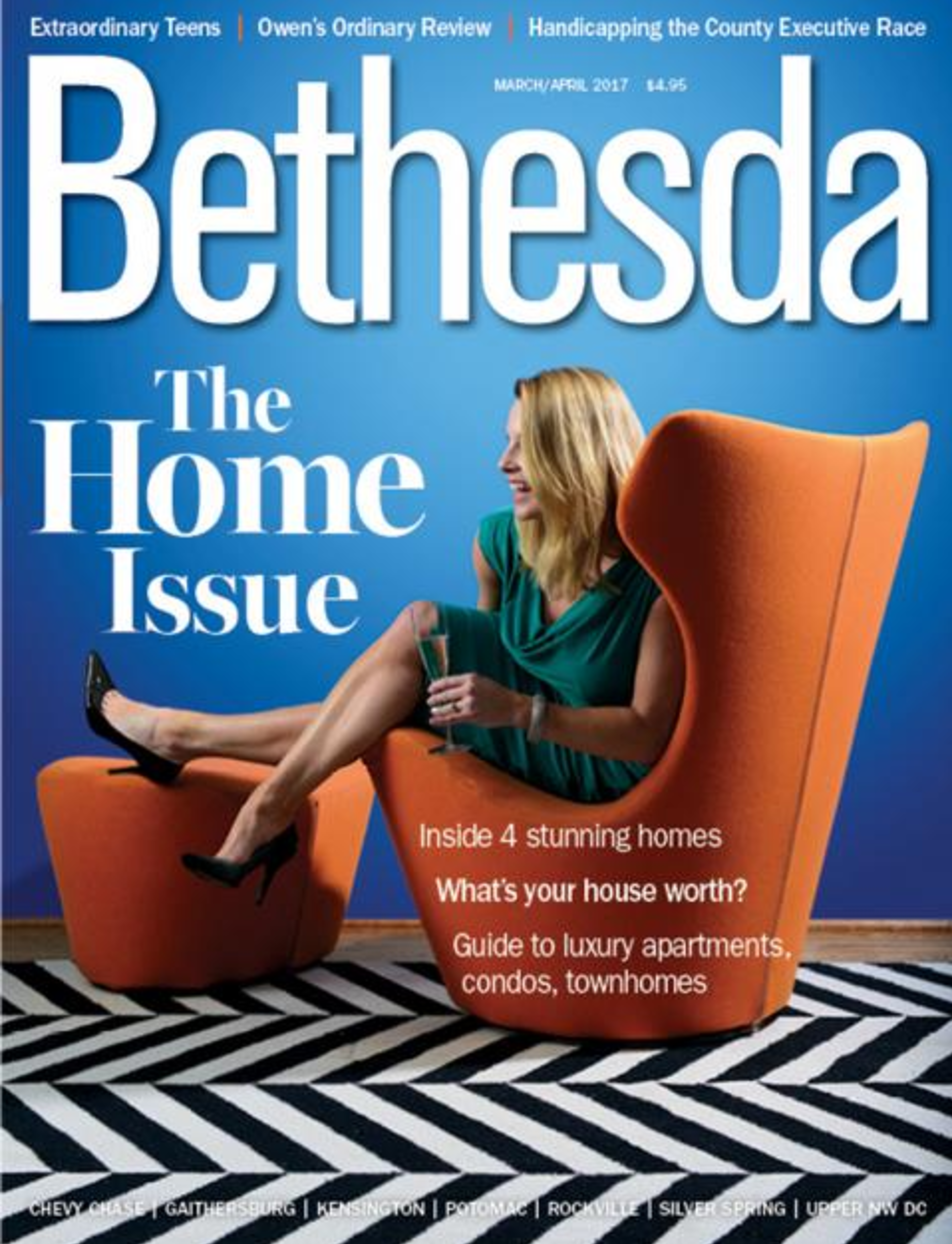 Blue room with orange chair designed by Annie Elliott