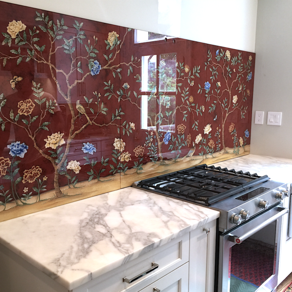 Large red painted backsplash panel with birds and flowers