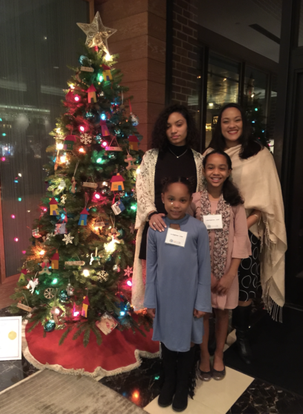 Family with Christmas tree