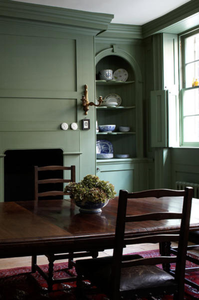 Dining room walls and trim painted dark green