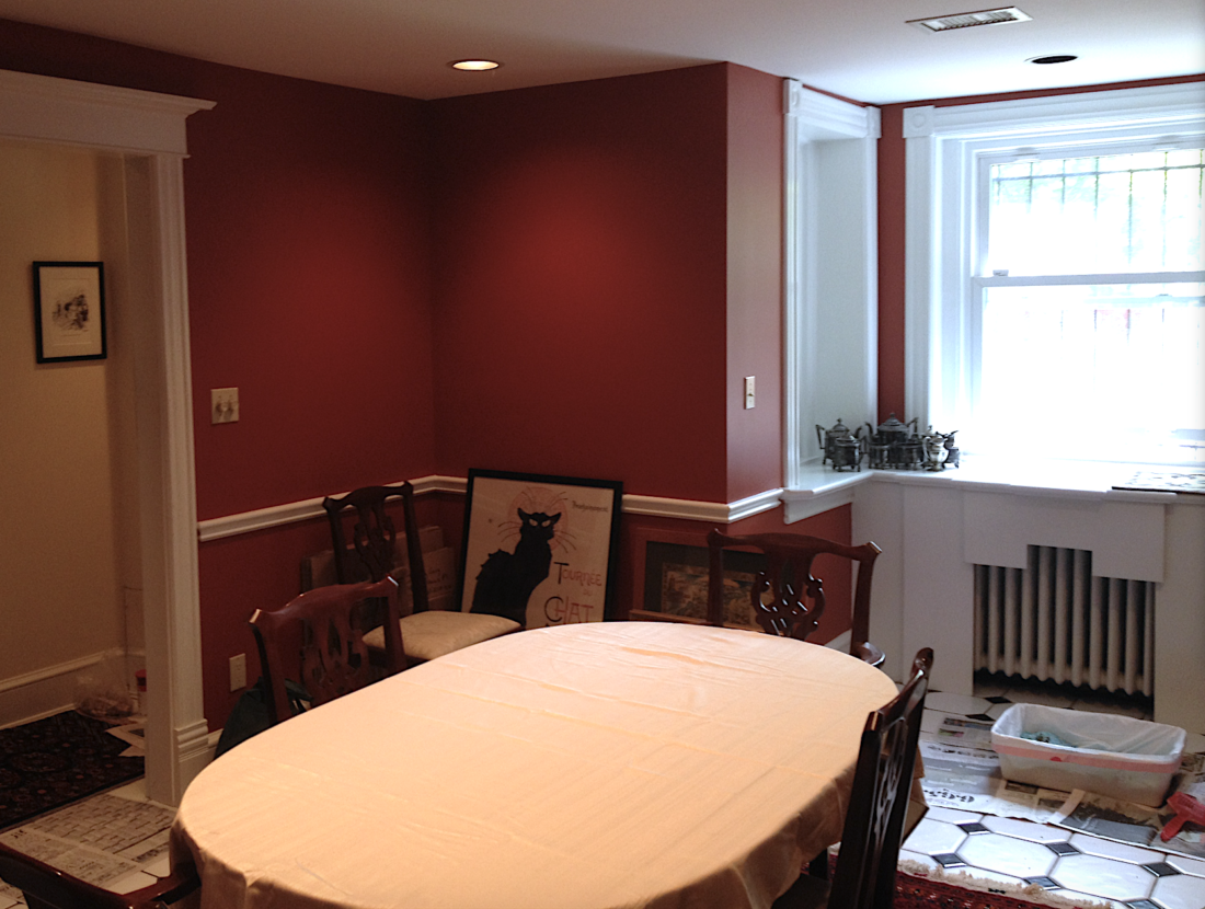 Red dining room with black and white floor