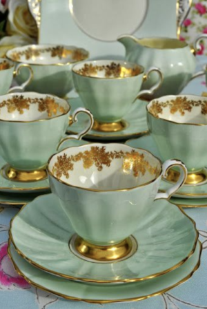 Light green and gold vintage china teacups and saucers