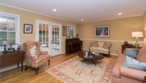 Pink and gold living room with Oriental rug