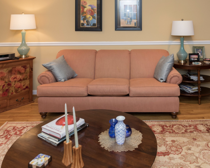 Pink sofa and gold Oriental rug