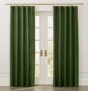 Green drapes on French doors with brass curtain rods