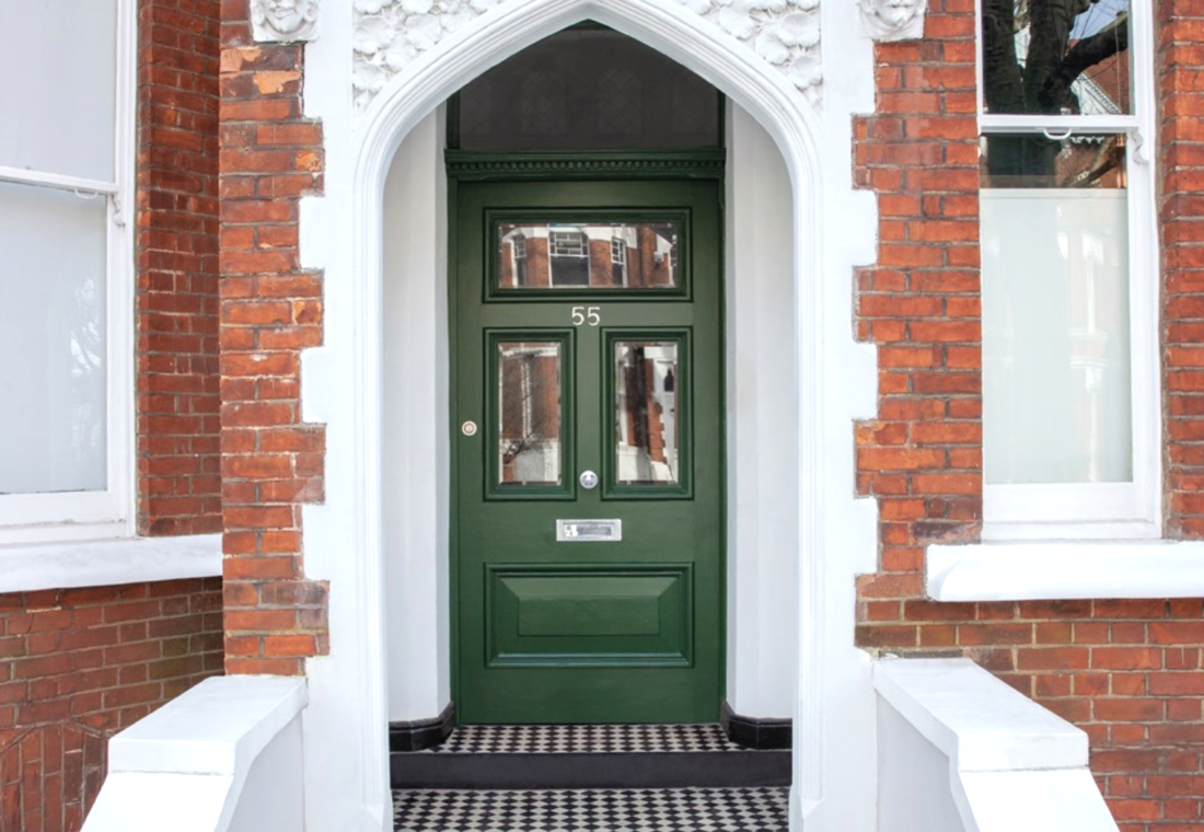 Brick house with green door