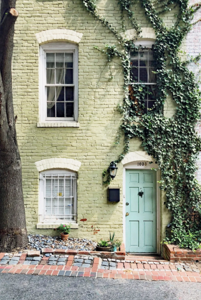 Light green painted brick row house townhouse