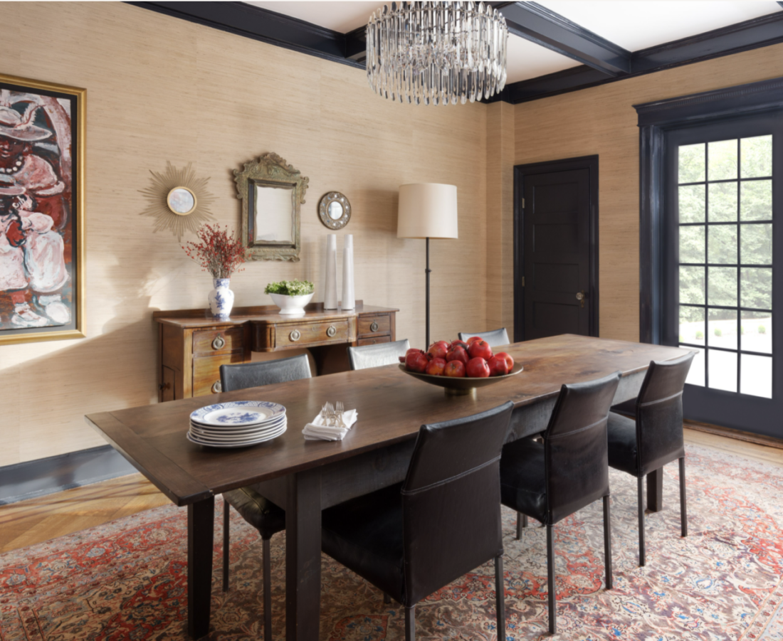 dining room with grasscloth, oriental rug and dark blue trim woodwork
