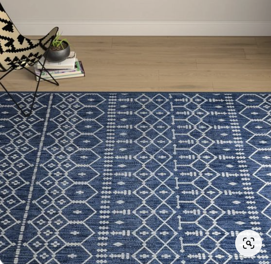 Blue and white patterned outdoor rug
