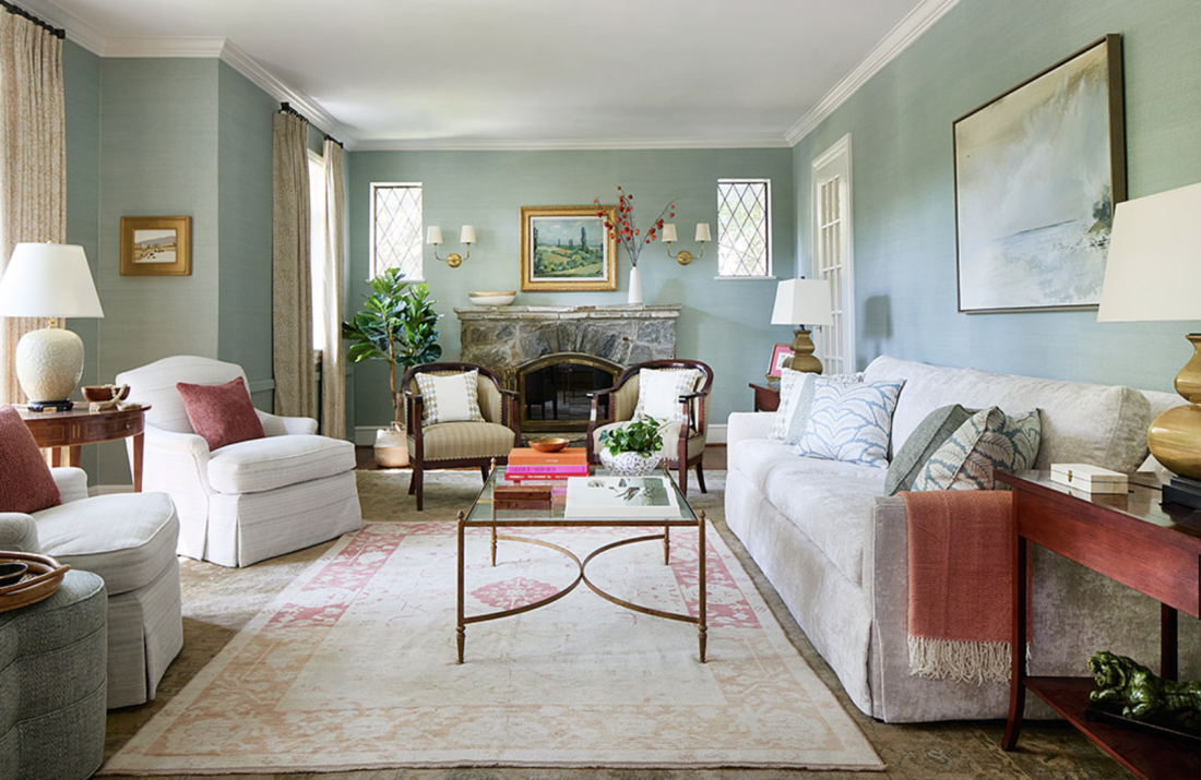 Large blue living room with white sofa and chairs