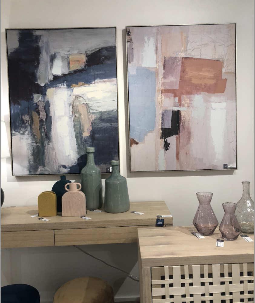 Pastel pink paintings and vases