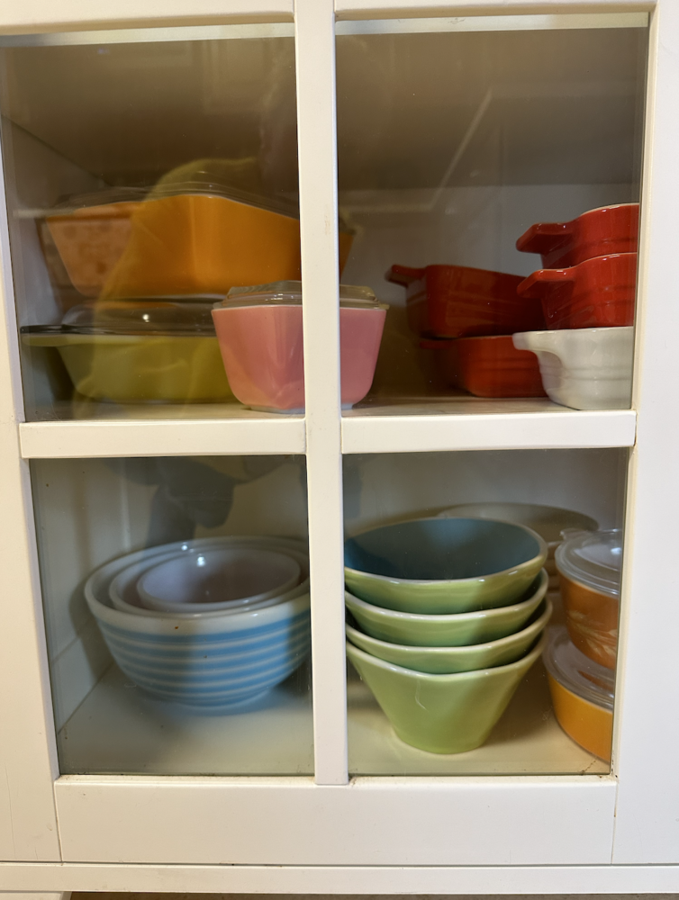 Vintage bowls and dishes in cabinet