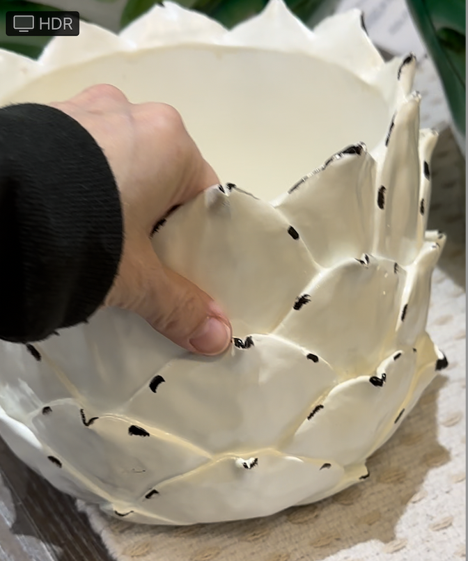 White planter shaped like an artichoke
