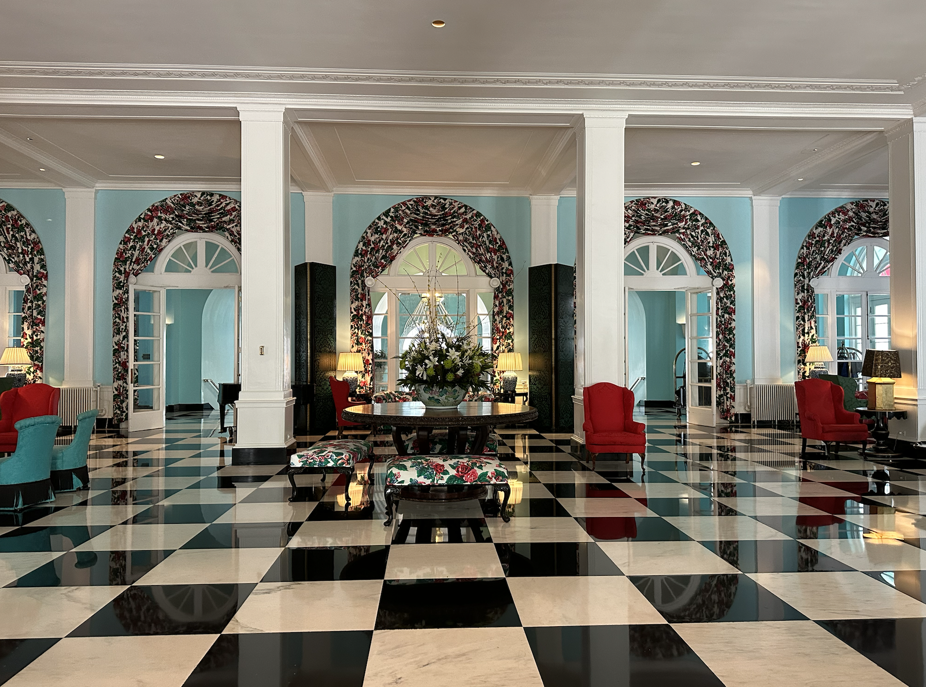 Colorful hotel lobby with black and white checkerboard tile