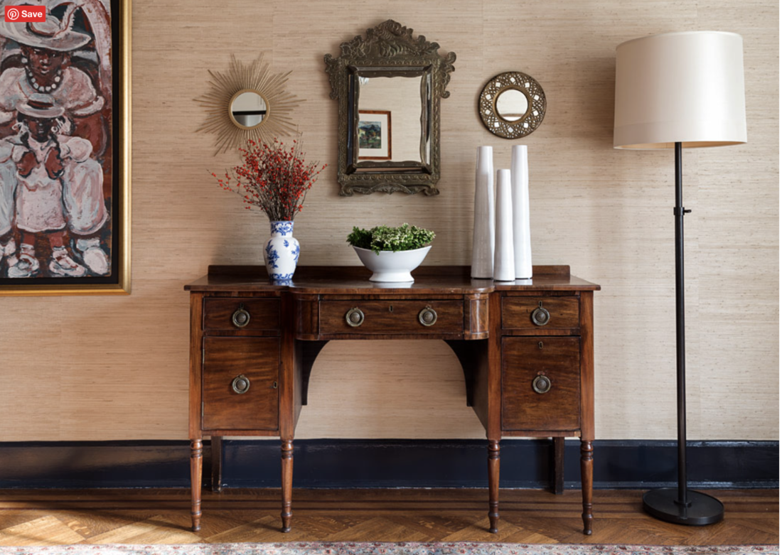 Dining room sideboard against natural grasscloth