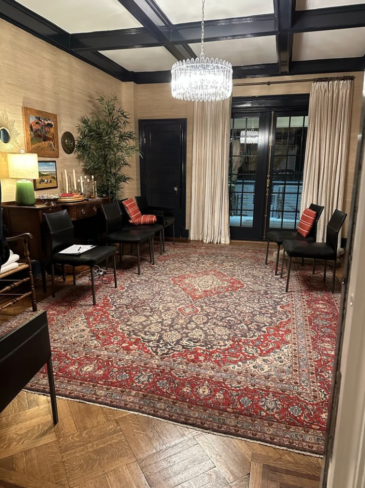 Dining room with Oriental rug, grasscloth, and coffered ceiling