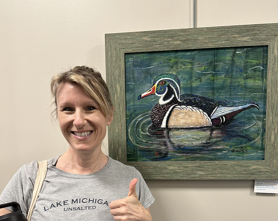 Woman with oil painting of a duck