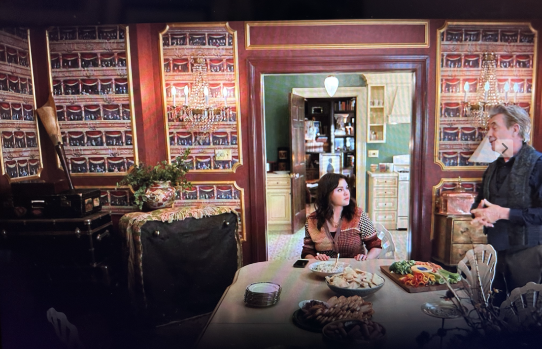 Woman and man in dining room with wallpaper 