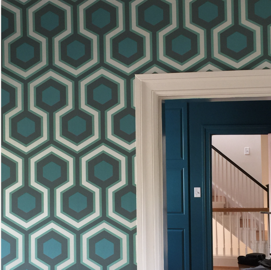 Hexagonal geometric wallpaper in blues and greens