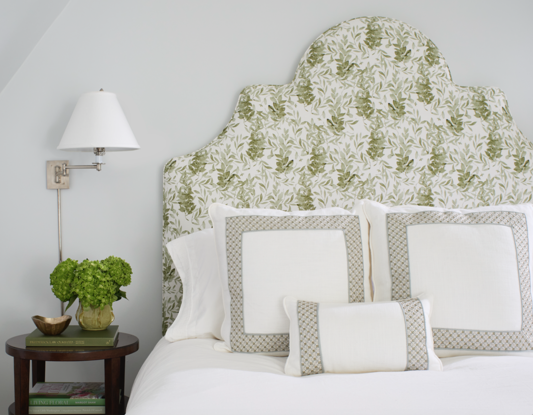Light gray bedroom with green and white floral headboard in Arlington, VA