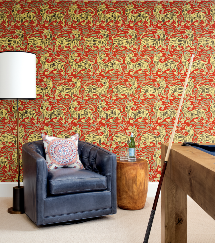 Game room with orange and yellow tiger wallpaper and a blue leather chair in Washington, DC