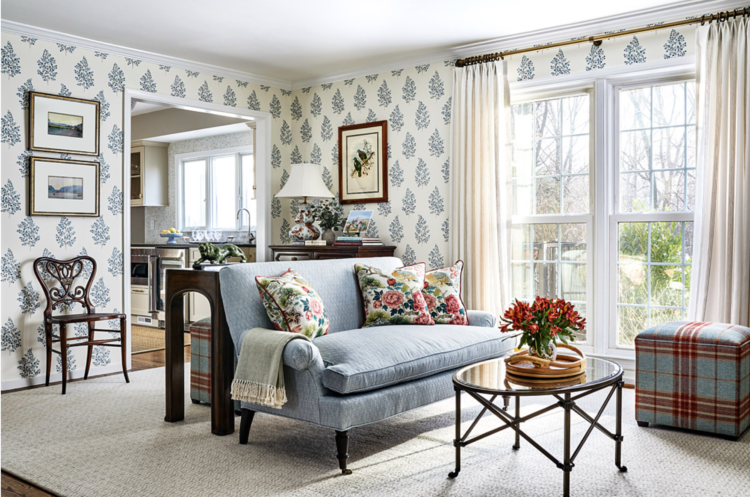 Living room with blue and white wallpaper, linen drapes, and light gray and white flatweave wool rug