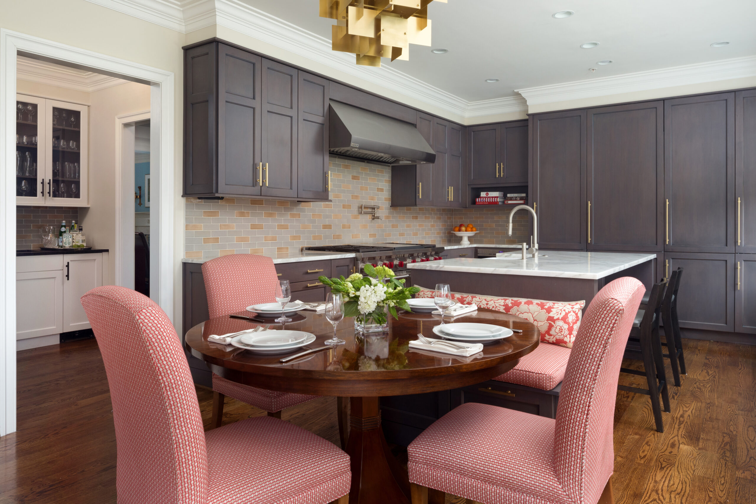 Traditional Chevy Chase, Maryland kitchen with gray stained cabinets and round wooden dining table
