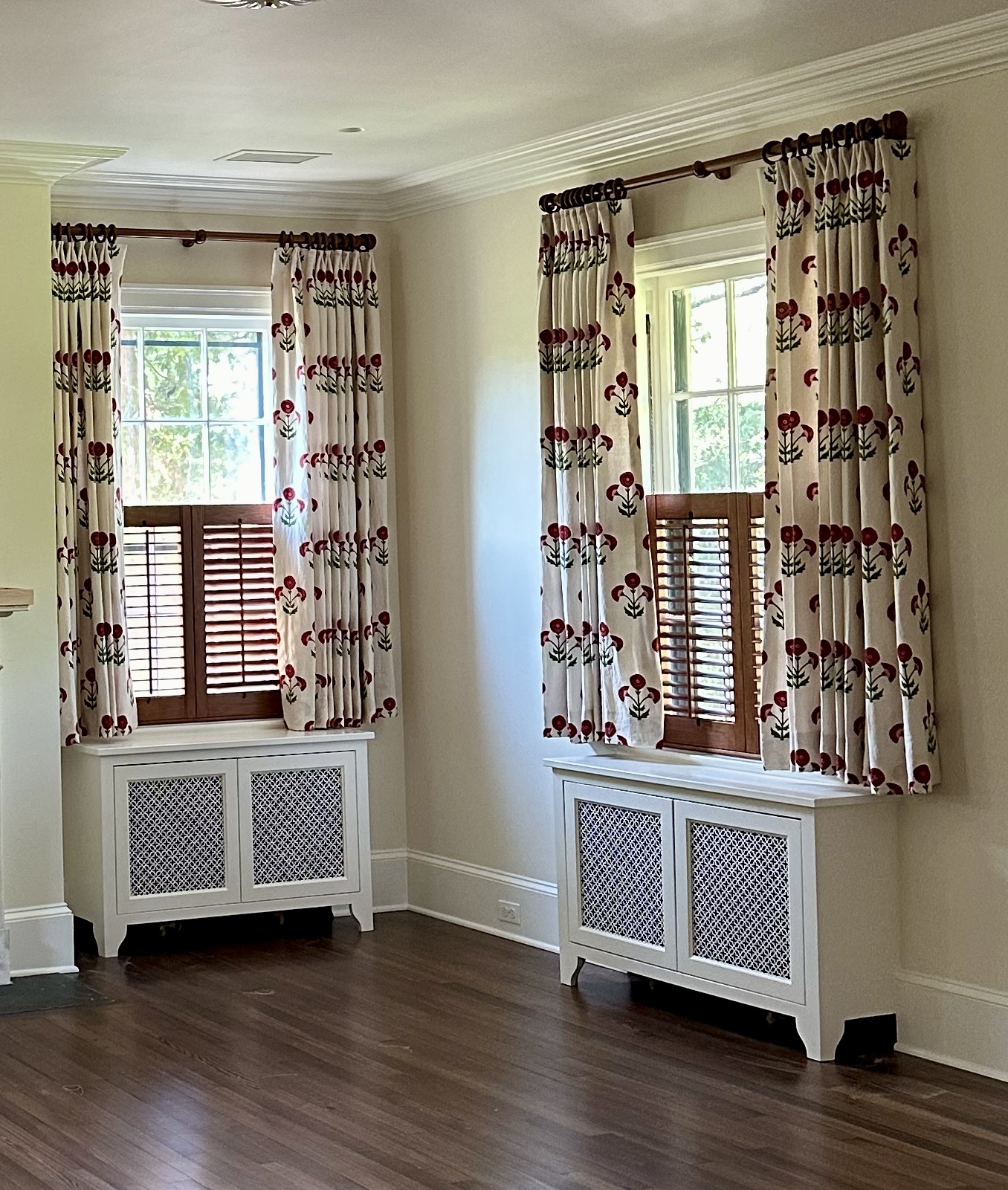 Yellow room with red and green flowered curtains