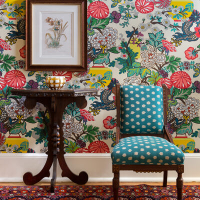 Floral wallpaper behind chair