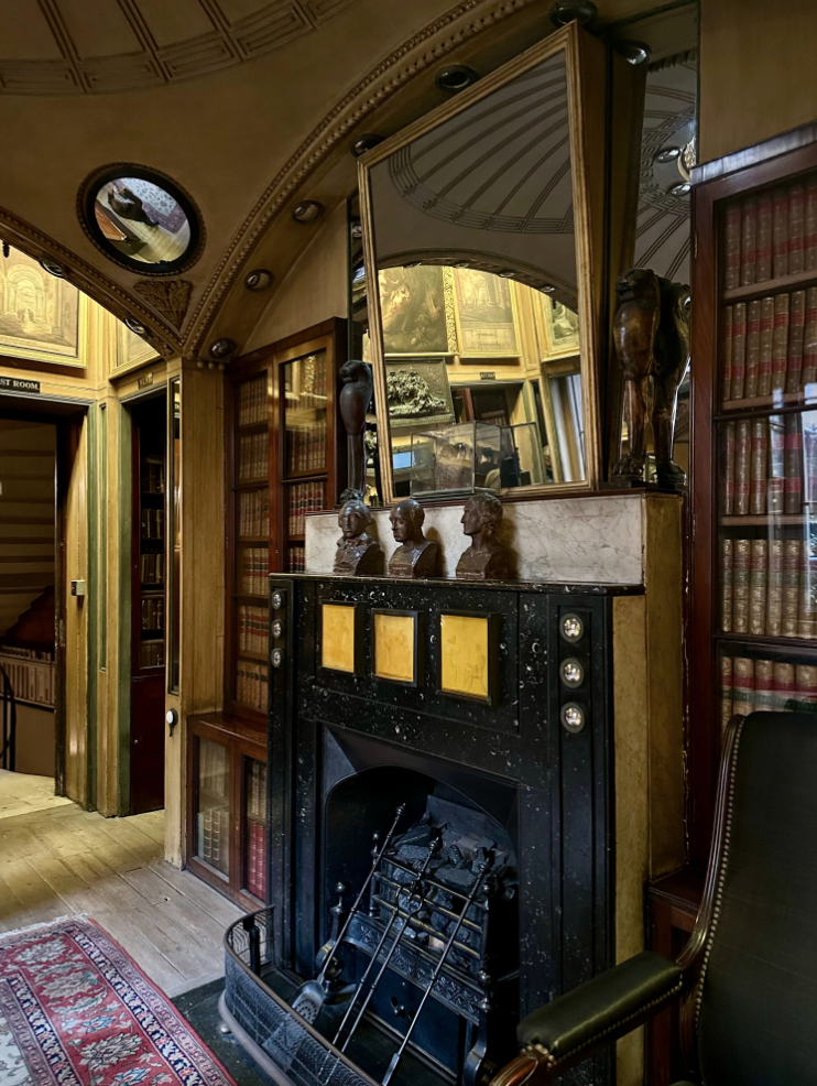 Fireplace with mirror over mirror above mantel