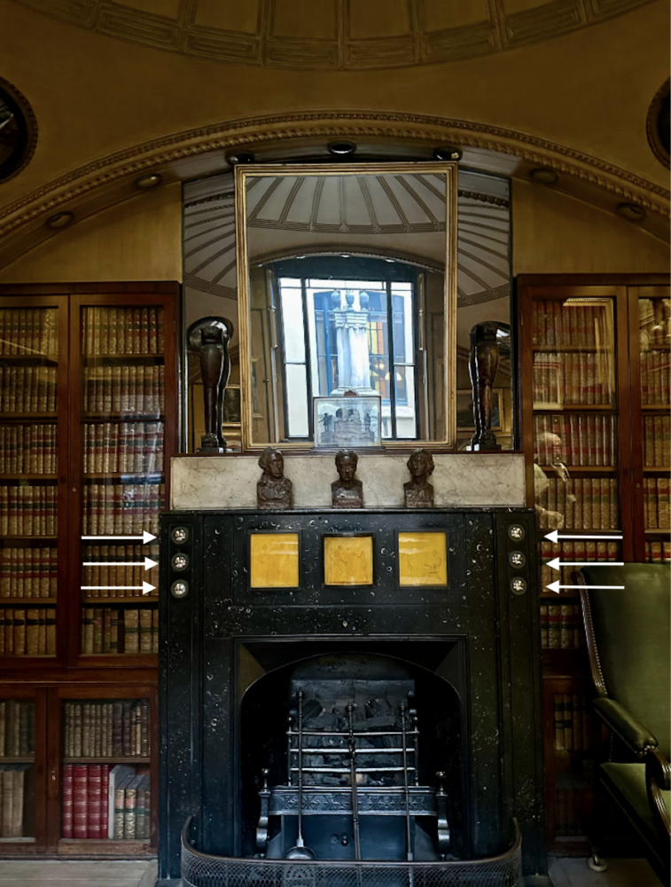 Fireplace with small convex mirrors on surround