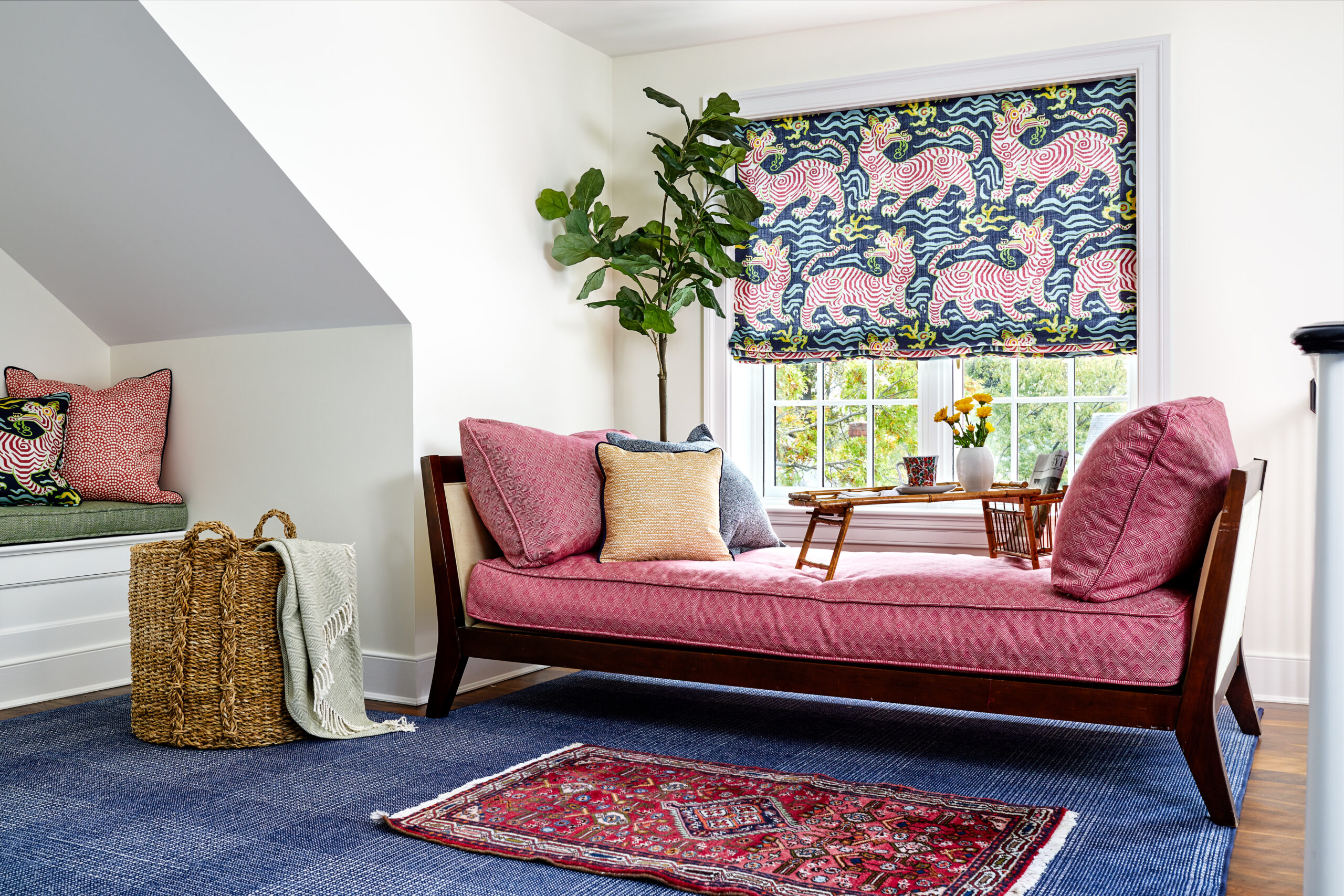 Pink and blue room with sitting area and window