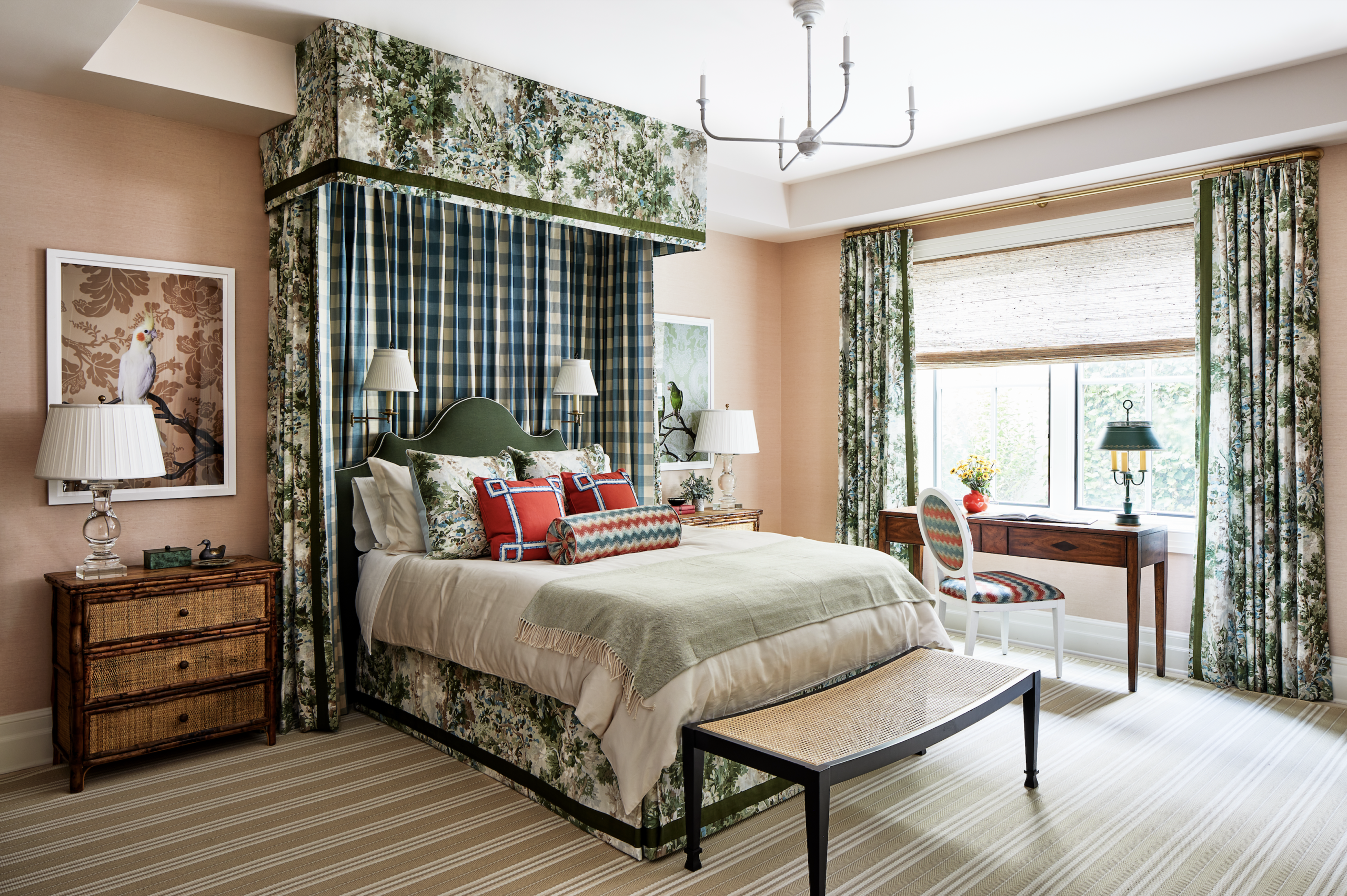 Bedroom with canopy bed and green and white drapes