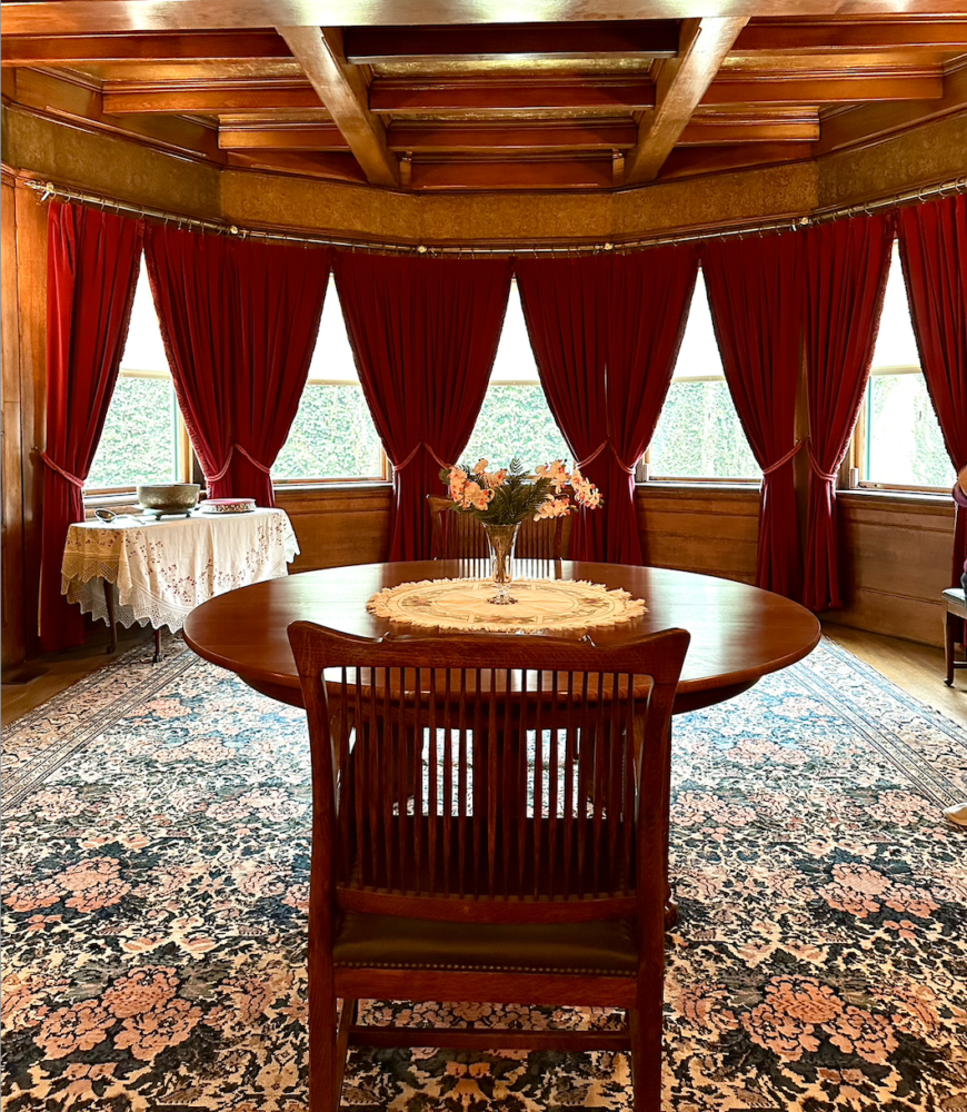 Curved window with multiple drapery panels