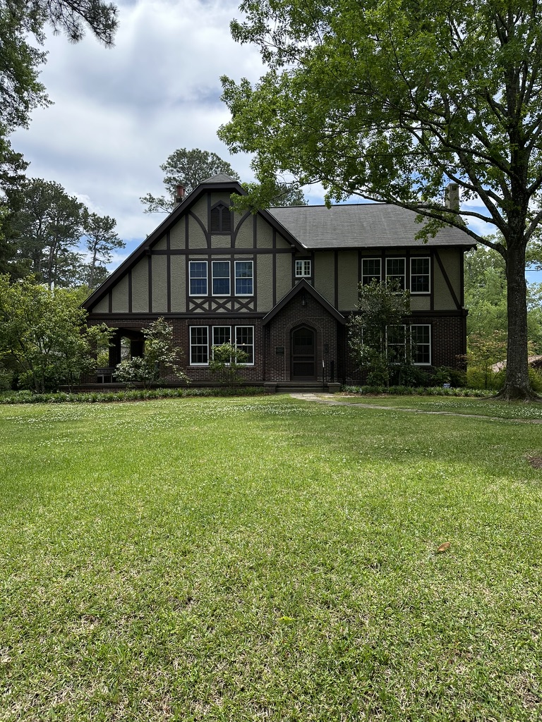 Large Tudor style house with big lawn