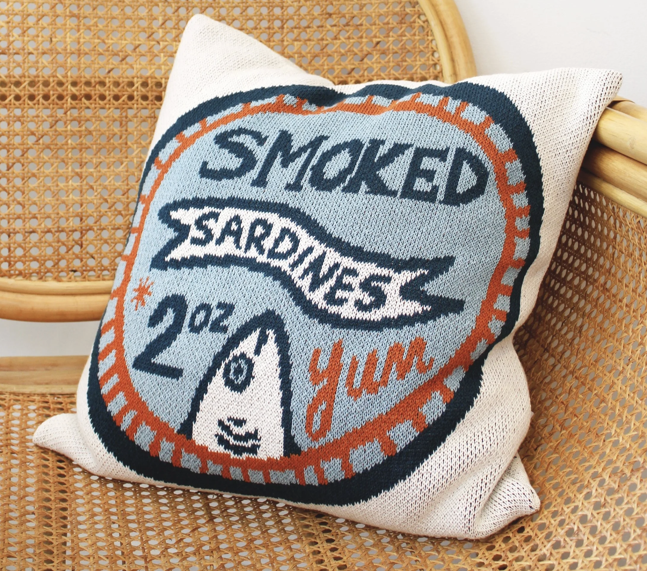Pillow with a sardines ad.