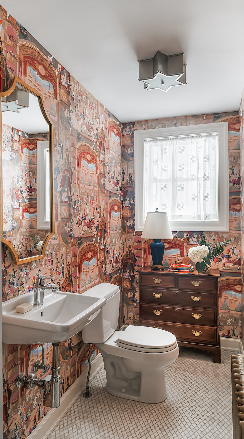 Powder room with colorful scenic wallpaper